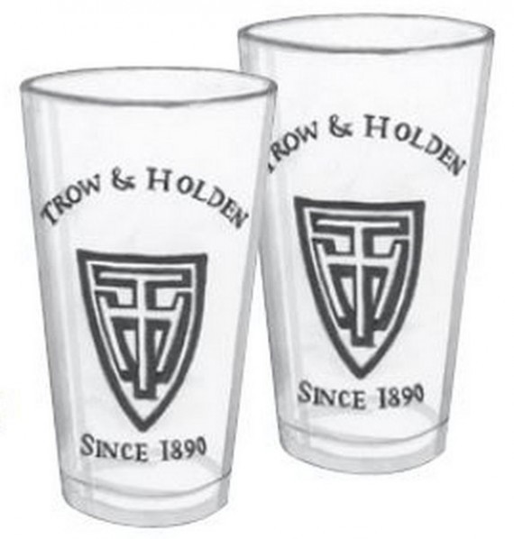 Two tall drinking glasses with the trow and holden logo